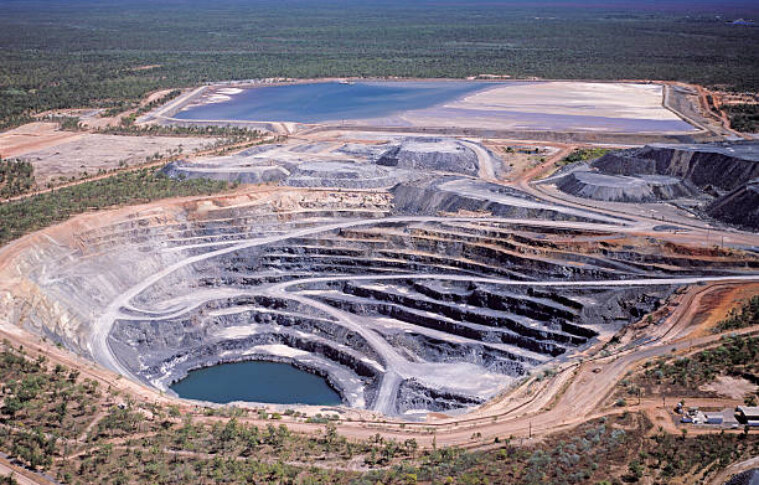 Optimisation of Cut-Off Grade Considering Dilution and Waste Rehabilitation Costs