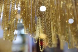 Gold falls on stronger dollar after Trump says he won't fire Powell