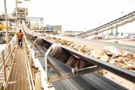 Dust control and spillage management in conveyor systems