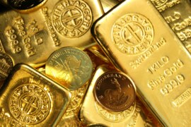 Gold set for third weekly loss amid stronger dollar, reduced Fed rate cut hopes