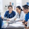 When should families consider hiring a caregiver?